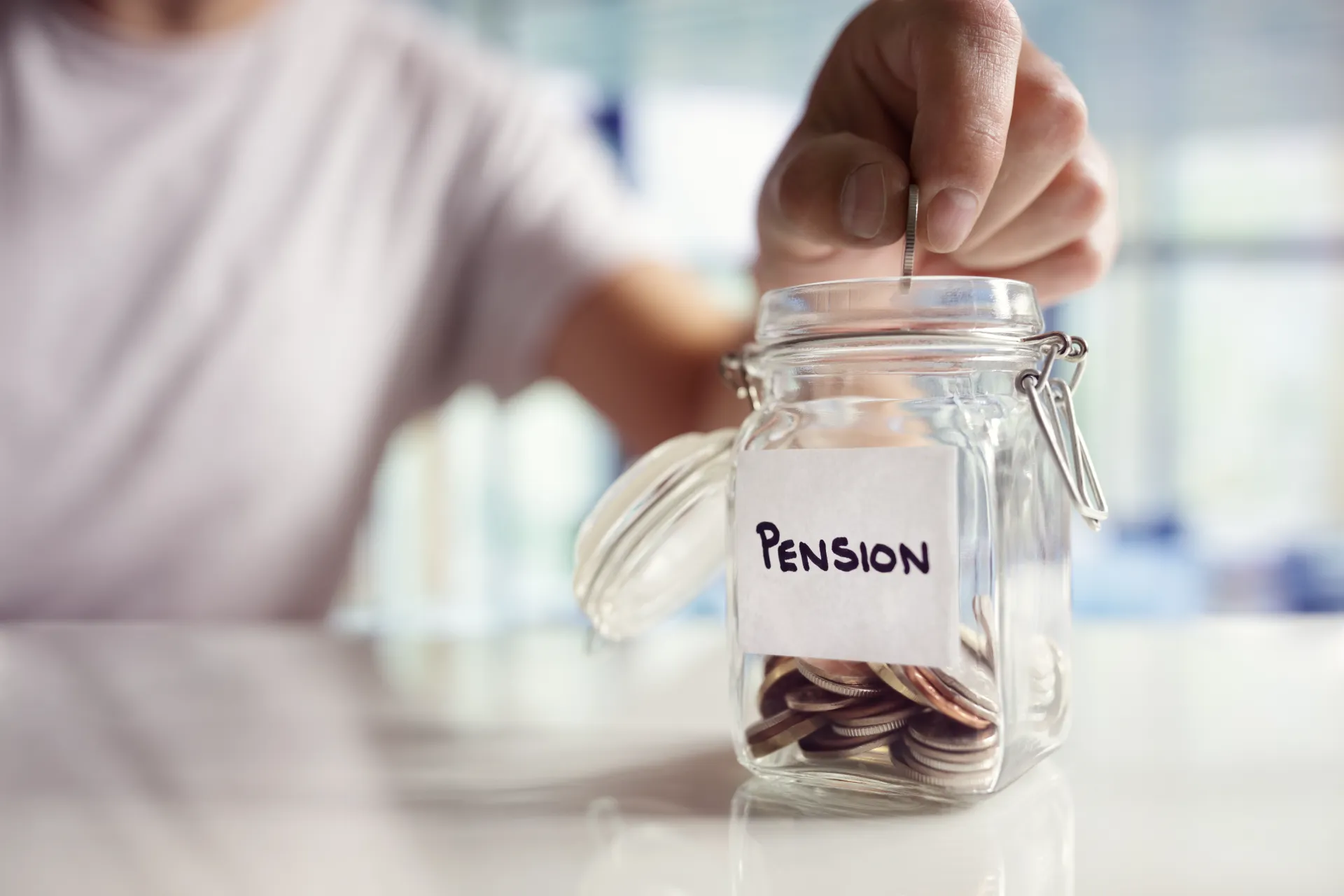 a person putting money into a scam pension 